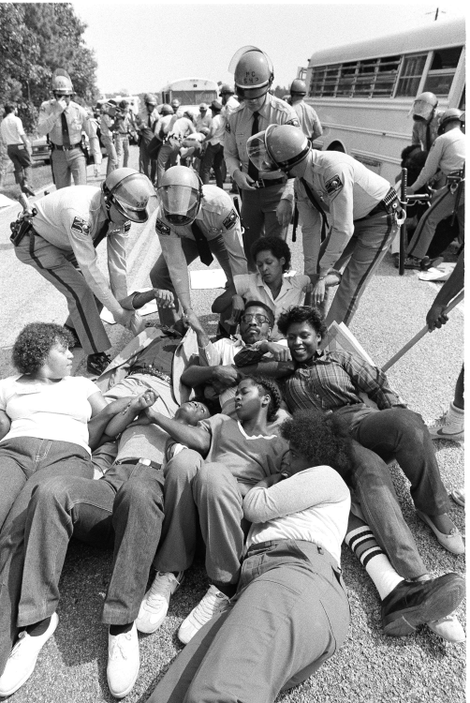 North Carolina State Troopers pick up protestors on the road to the Warren County Landfill in North Carolina, on September 17, 1982.